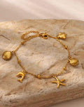 Gold Ocean Charm Bracelet - Dolphin Starfish Shell